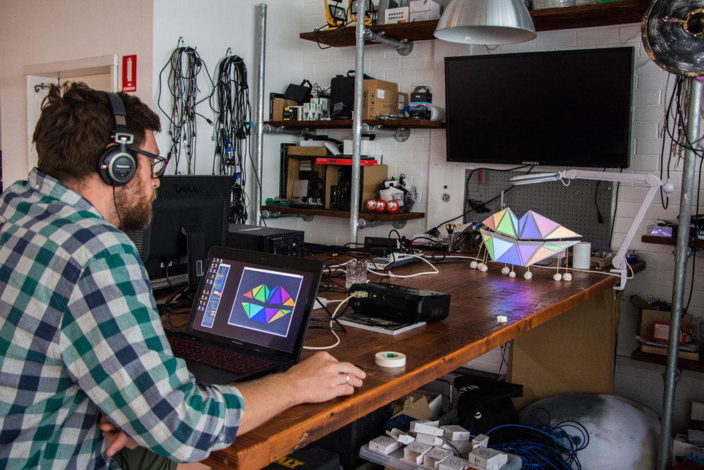 S1T2 employee working on projection mapped artwork
