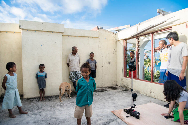 Fijian children wait behind the scenes of 'Our Home, Our People' virtual reality project