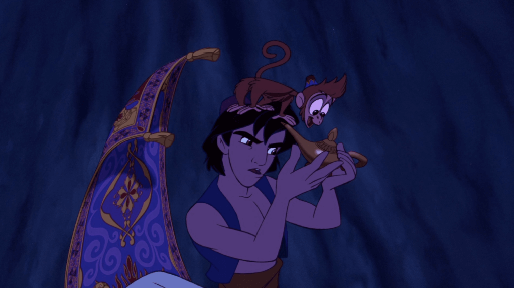 Aladdin, Abu and the magic carpet examine the Genie's lamp