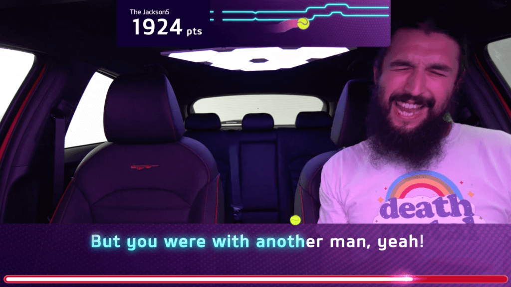 S1T2 team member tests the Kia Caraoke experience and game graphics