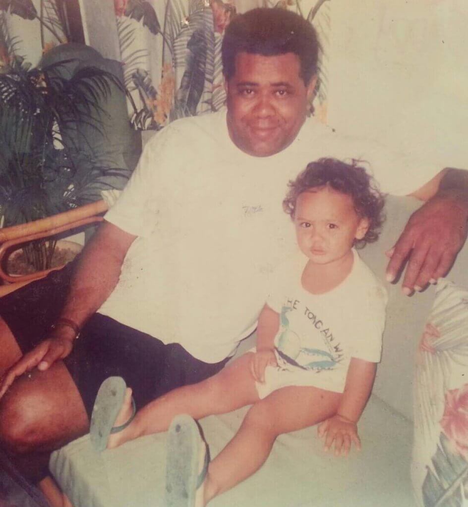 An old photo of Arieta and her father from her childhood