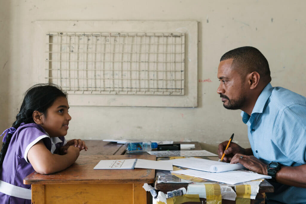 A member of the Beyond the Stars team conducts a child survey in Fiji