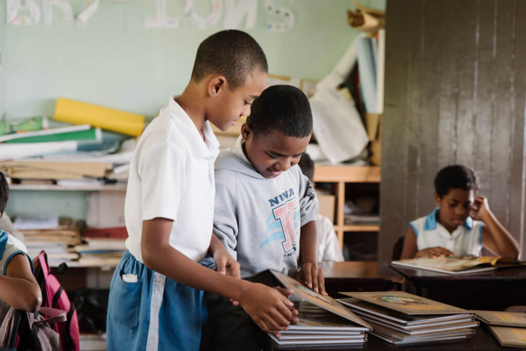 Two Fijian children use the Beyond the Stars program in class at a school in Viti Levu