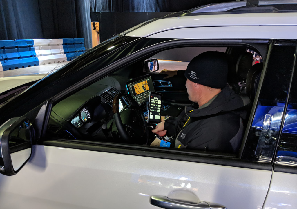 Professional driver uses a tracking app during the Ford Explorer VR experience