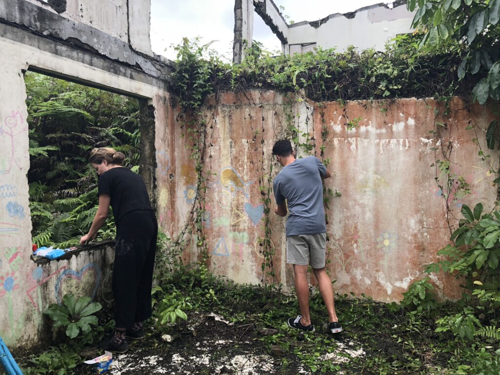 Film crew prepares a set in rural Fiji for the UNICEF Draw the Line TVC